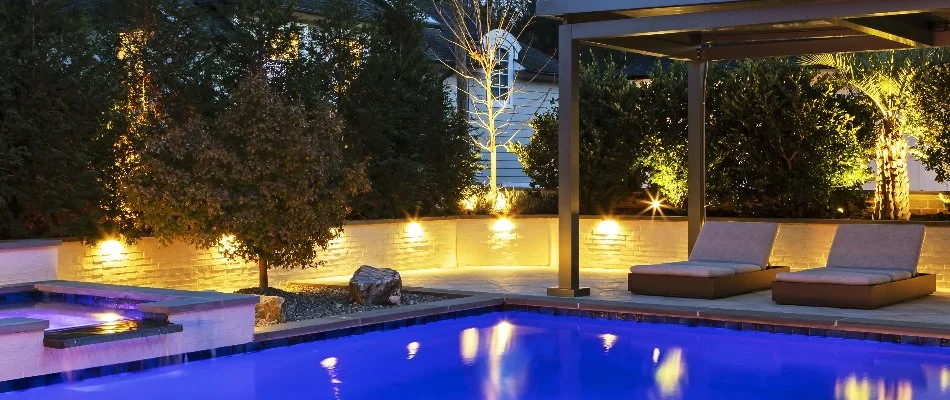 Pool deck in Cary, NC, with LED lights on a short wall.