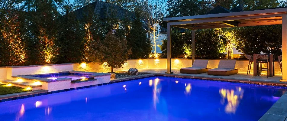 Raised planter bed in Cary, NC, with outdoor lights near a pool.