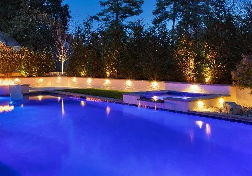 Pool and retaining wall with lighting.